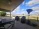 Covered patio with table, chairs, and grill at 650 N Hawes Rd # 4820, Mesa, AZ 85207