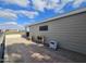 Side patio with potted plants and access to the back yard at 650 N Hawes Rd # 4820, Mesa, AZ 85207