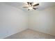 Bright bedroom with ceiling fan and neutral carpeting at 6610 E University Dr # 157, Mesa, AZ 85205