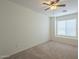 Well-lit bedroom featuring a window and ceiling fan at 6610 E University Dr # 157, Mesa, AZ 85205