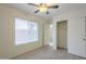 Bedroom with ceiling fan, window blinds, and mirrored closet at 6610 E University Dr # 157, Mesa, AZ 85205