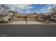 Two-unit stucco home with two-car garages and landscaping at 6610 E University Dr # 157, Mesa, AZ 85205