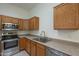 Modern kitchen with stainless steel appliances and wood cabinets at 6610 E University Dr # 157, Mesa, AZ 85205