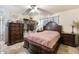 Bedroom with a queen-size bed, dresser, and closet at 6725 E Moreland St, Scottsdale, AZ 85257