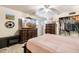 Main bedroom with large TV, dresser, and closet at 6725 E Moreland St, Scottsdale, AZ 85257