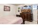 Main bedroom with large TV, dresser, and closet at 6725 E Moreland St, Scottsdale, AZ 85257