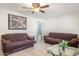 Living room with two brown couches and a glass top coffee table at 6725 E Moreland St, Scottsdale, AZ 85257