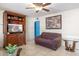 Living room featuring brown couches and a wood entertainment center at 6725 E Moreland St, Scottsdale, AZ 85257