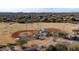 Aerial view of a community baseball field with covered dugouts and walkway surrounded by residential area at 7654 E Quill Ln, Scottsdale, AZ 85255