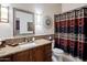 Well-maintained bathroom with granite countertop, decorative mirror, and shower-tub combination at 7654 E Quill Ln, Scottsdale, AZ 85255