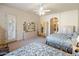 Spacious bedroom with a light beige carpet, traditional furniture, and a view towards the ensuite at 7654 E Quill Ln, Scottsdale, AZ 85255