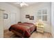 Cozy bedroom with light-colored walls, and a large window with shutters at 7654 E Quill Ln, Scottsdale, AZ 85255