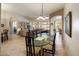 Open-concept dining room with tile floors and open view to a bright living room at 7654 E Quill Ln, Scottsdale, AZ 85255