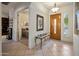 Bright foyer with a light wood door and view to a bedroom with neutral tones at 7654 E Quill Ln, Scottsdale, AZ 85255