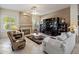 Inviting living room featuring a stone fireplace, media center, and comfortable seating at 7654 E Quill Ln, Scottsdale, AZ 85255