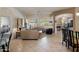 Bright living room with an open floor plan, fireplace, and tile flooring at 7654 E Quill Ln, Scottsdale, AZ 85255