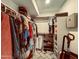 Walk-in closet with ample hanging space, shelving, and built-in storage solutions for organization at 7777 E 2Nd St # 101, Scottsdale, AZ 85251