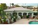 Exterior view of community clubhouse with pool access, desert landscaping and stucco finish at 7777 E 2Nd St # 101, Scottsdale, AZ 85251