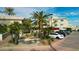 Landscaped community featuring lush greenery, palm trees, and a decorative water feature at 7777 E 2Nd St # 101, Scottsdale, AZ 85251