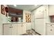 Spacious kitchen with white cabinets, a vintage refrigerator, and patterned flooring at 7777 E 2Nd St # 101, Scottsdale, AZ 85251