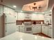 Bright kitchen with white cabinetry, quartz countertops, and modern appliances at 7777 E 2Nd St # 101, Scottsdale, AZ 85251