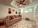 Cozy living room featuring comfortable seating, decorative wall art, and a unique tiled floor at 7777 E 2Nd St # 101, Scottsdale, AZ 85251