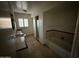 Bathroom with tiled floor, bathtub, and sink at 801 W Earll Dr, Phoenix, AZ 85013