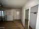 Bedroom with built-in shelving and mirrored closet at 801 W Earll Dr, Phoenix, AZ 85013