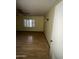 Spacious bedroom featuring laminate floors and a ceiling fan at 801 W Earll Dr, Phoenix, AZ 85013