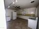 Kitchen features white cabinets and appliances at 801 W Earll Dr, Phoenix, AZ 85013