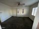 Living room with carpet, ceiling fan, and window with shutters at 801 W Earll Dr, Phoenix, AZ 85013