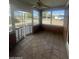 Bright sunroom with tiled floor and brick walls at 801 W Earll Dr, Phoenix, AZ 85013