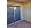 Private patio with sliding glass doors at 8221 E Garfield St # L122, Scottsdale, AZ 85257