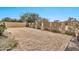 Large backyard with a grassy area and a tall fence at 8334 E Inca St, Mesa, AZ 85207