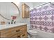 Bathroom with a tub shower and wood vanity at 8334 E Inca St, Mesa, AZ 85207