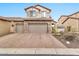 Two-story home with stone accents and a two-car garage at 8334 E Inca St, Mesa, AZ 85207