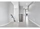 Light-filled hallway with stairs and wood-look flooring at 8334 E Inca St, Mesa, AZ 85207