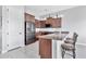 Kitchen with island, stainless steel appliances, and wood cabinets at 8334 E Inca St, Mesa, AZ 85207