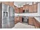 Modern kitchen with stainless steel appliances and wood cabinets at 8334 E Inca St, Mesa, AZ 85207