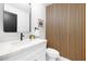 Modern bathroom with white vanity and wood wall accents at 8626 E Montebello Ave, Scottsdale, AZ 85250