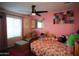 Charming bedroom with floral bedding and pink walls at 903 W Loughlin Dr, Chandler, AZ 85225