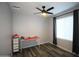 Bright bedroom featuring a desk, window, and ceiling fan at 903 W Loughlin Dr, Chandler, AZ 85225