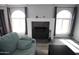 Living room fireplace with dark gray stone and black metal screen at 903 W Loughlin Dr, Chandler, AZ 85225