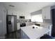 Modern kitchen with stainless steel appliances and white cabinets at 903 W Loughlin Dr, Chandler, AZ 85225