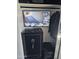 A security system monitor is set up with multiple camera views above a safe in a closet at 903 W Loughlin Dr, Chandler, AZ 85225