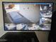 Wall mounted security monitor displays multiple camera views at 903 W Loughlin Dr, Chandler, AZ 85225