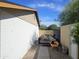 View of the side yard with a trailer for hauling at 903 W Loughlin Dr, Chandler, AZ 85225