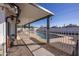 A covered patio overlooks this sparkling swimming pool, fenced for safety in the expansive, private backyard at 941 W Peralta Ave, Mesa, AZ 85210