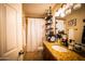 Well-appointed bathroom with granite vanity and shelving at 941 W Peralta Ave, Mesa, AZ 85210