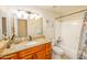 Bathroom featuring a single sink vanity with a combination shower and bathtub at 941 W Peralta Ave, Mesa, AZ 85210